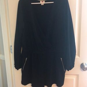 Black shorts romper. Long sleeve. Low cut